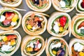 Small Mexican tortilla rolls filled with minced meat with beans, feta, zucchini and paprika, crispy baked Royalty Free Stock Photo