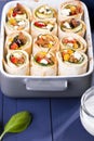Small Mexican tortilla rolls filled with minced meat with beans, feta, zucchini and paprika, crispy baked Royalty Free Stock Photo