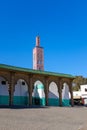 Small minaret popping over a wall