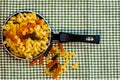 Small mini frying pan with tricolor raw fusilli pasta in a rustic composition Royalty Free Stock Photo