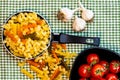 Small mini frying pan with tricolor raw fusilli pasta in a rustic composition Royalty Free Stock Photo