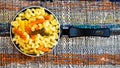 Small mini frying pan with tricolor raw fusilli pasta in a rustic composition Royalty Free Stock Photo