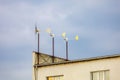 Small mini wind turbines for generating electricity in an urban environment. Background Royalty Free Stock Photo