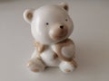 Small miniature ceramic bear with white background