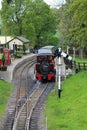 A small miniature steam train waiting at the station Royalty Free Stock Photo