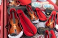 Small Miniature Violins with their Stick and Red Case