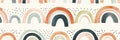 Small, minimalist rainbows in muted tones, repeated in a cute pattern on a white background Royalty Free Stock Photo