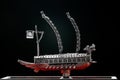 A model of famous ancient Korean ironclad war ship. Korean turtle ship on a black background. Black and white and red