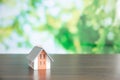 small model house with green bokeh background Royalty Free Stock Photo