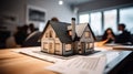 Small Model House Resting on Real Estate Documents As Buyers Discuss Their Agreement - Generative AI