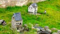 Small models of houses in someones garden