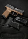 A small modern brown semi-automatic pistols. A short-barreled weapon for self-defense. Arming the police, special units and the