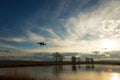 Small modern drone hovering taking picture of sunset. Royalty Free Stock Photo