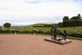 Petergof, Russia, July 2019. Monument in the merchant harbor with an anchor and steering wheel.