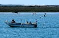 Small Motor Boat Anchored Off Olao Portugal