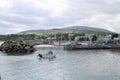 Small motor boat entering harbour