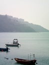 Small motor boats moored in a bay in Hong Kong. Royalty Free Stock Photo