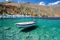 Small motorboat at clear water bay of Loutro town on Crete island, Greece Royalty Free Stock Photo