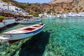 Small motorboat at clear water bay of Loutro town on Crete island, Greece