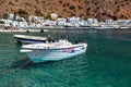 Small motorboats at clear water bay of Loutro town on Crete island, Greece Royalty Free Stock Photo