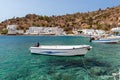 Small motorboats at clear water bay of Loutro town on Crete island, Greece Royalty Free Stock Photo