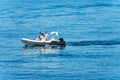 Small Motorized Dinghy with a Family on Board - Mediterranean Sea Italy Royalty Free Stock Photo