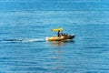 Small Motorized Dinghy with a Family on Board - Mediterranean Sea Italy Royalty Free Stock Photo