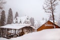 A small mountain cottage village on a winter day with snow Royalty Free Stock Photo