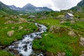 small mountain creek between rocks in the mountains Royalty Free Stock Photo