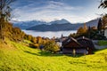 small mountain village and snowy peaks of Alps in the background Royalty Free Stock Photo