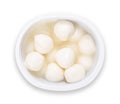 Small mozzarella balls with brine, white cheese in a plastic cup Royalty Free Stock Photo