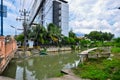 Small muddy city river in Thailand