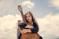 Small music lover. free music content. Teenage musician playing guitar. Portrait of little kid playing guitar on sky Royalty Free Stock Photo