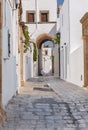 Small narrow alley in Greek old beautiful town Lindos at island Royalty Free Stock Photo