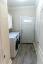 small narrow laundry room with washer and dryer Royalty Free Stock Photo