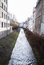 Small narrow mountain river flows through the city Royalty Free Stock Photo