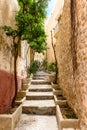 Small narrow rustic street inside the old village Dalt Vila in Ibiza town