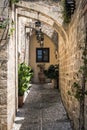 Small narrow street with ancient arches and walls in Rhodes town. Rhodes island., Greece Royalty Free Stock Photo