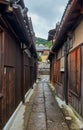 Small narrow street surrounded by the typical Kyoto machiya buildings. Higashiyama. Kyoto. Japan