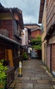 Small narrow street surrounded by the typical Kyoto machiya buildings. Higashiyama. Kyoto. Japan
