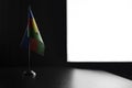 Small national flag of the New Caledonia on a black background
