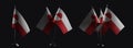 Small national flags of the Greenland on a black background