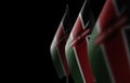 Small national flags of the Kenya on a black background