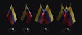 Small national flags of the Venezuela on a black background