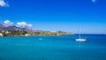 Small natural harbor with anchored sailing boat, Agios Nikolaos, Crete.