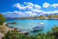 Small natural harbor with anchored sailing boat, Agios Nikolaos, Crete. Royalty Free Stock Photo