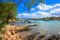 Small natural harbor with anchored sailing boat, Agios Nikolaos, Crete. Royalty Free Stock Photo