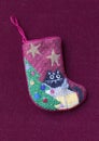 Small needlepoint Christmas stocking with cat Royalty Free Stock Photo