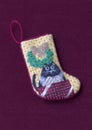 Small needlepoint Christmas stocking with cat Royalty Free Stock Photo