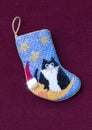 Small needlepoint Christmas stocking with cat Royalty Free Stock Photo